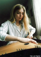 Anni playing on a concert kantele